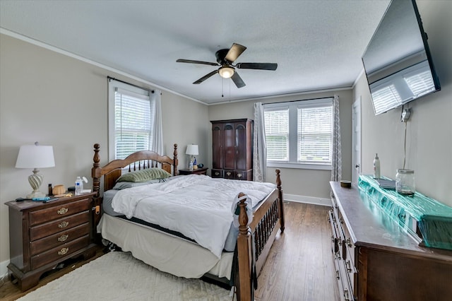 501 Beaufort Dr, Augusta, GA 30904 - bedroom featuring crown molding, multiple windows, wood finished floors, and ceiling fan