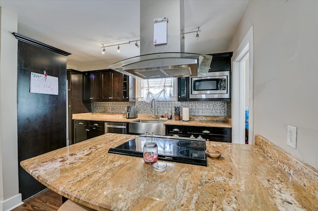 501 Beaufort Dr, Augusta, GA 30904 - kitchen featuring exhaust hood, stainless steel appliances, decorative backsplash, light stone counters, and track lighting