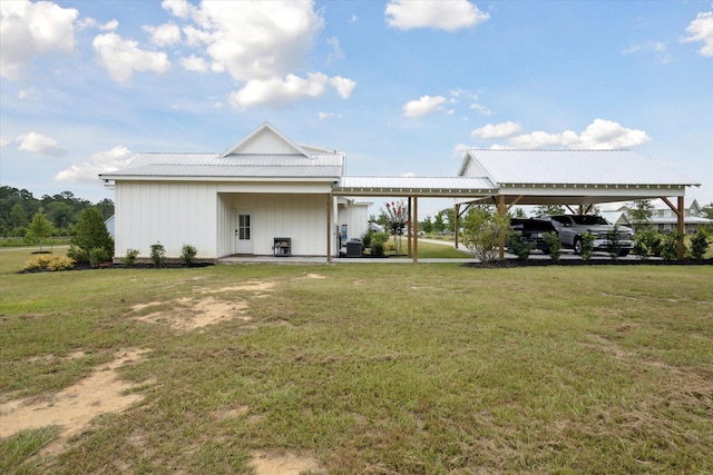 1513 Paris Ave, Swainsboro, GA 30401 - rear view of property featuring a lawn and a metal roof