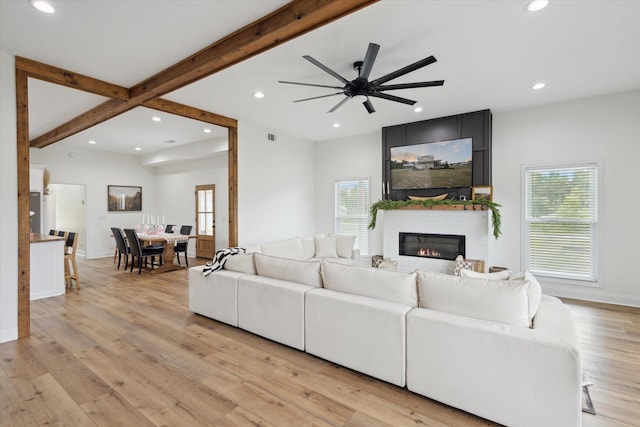 1513 Paris Ave, Swainsboro, GA 30401 - living area with recessed lighting, a fireplace, beamed ceiling, light wood finished floors, and a ceiling fan