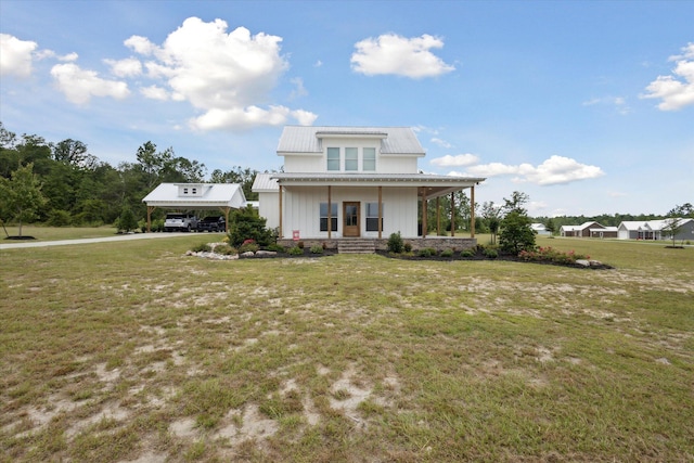 1513 Paris Ave, Swainsboro, GA 30401 - rear view of property featuring a porch, a lawn, a metal roof, a carport, and board and batten siding