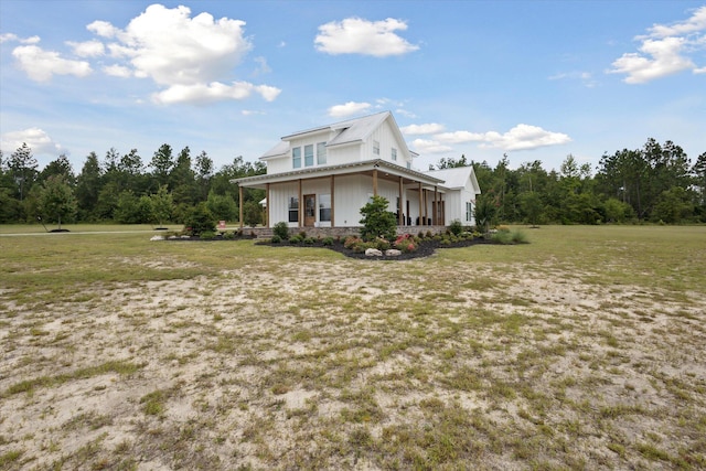 1513 Paris Ave, Swainsboro, GA 30401 - view of side of home featuring a lawn and a metal roof