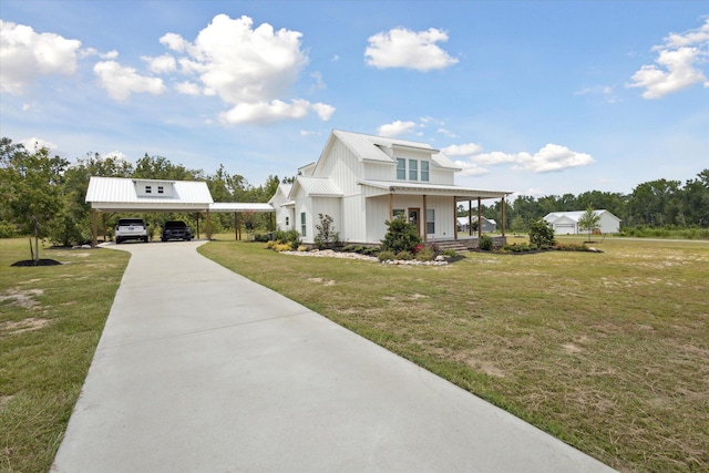 1513 Paris Ave, Swainsboro, GA 30401 - modern farmhouse style home with a front lawn, concrete driveway, a porch, and a metal roof