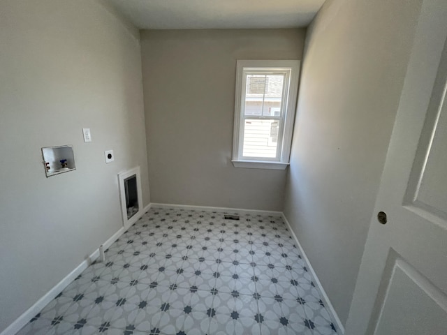 washroom featuring hookup for a washing machine, laundry area, baseboards, light floors, and electric dryer hookup