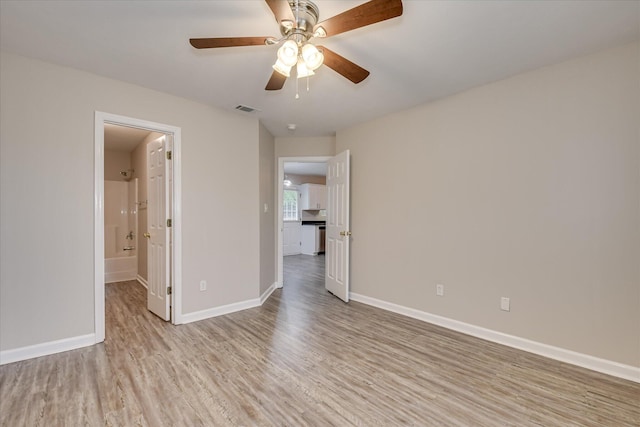 1907 Lobelia Ln, Augusta, GA 30906 - unfurnished bedroom with light wood finished floors, baseboards, a ceiling fan, and connected bathroom