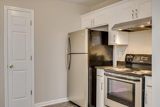 1907 Lobelia Ln, Augusta, GA 30906 - kitchen with under cabinet range hood, stainless steel appliances, white cabinetry, dark countertops, and baseboards