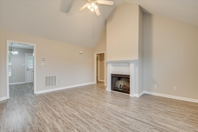 1907 Lobelia Ln, Augusta, GA 30906 - unfurnished living room with wood finished floors, a ceiling fan, lofted ceiling, a fireplace, and baseboards