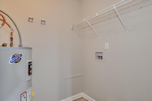 1907 Lobelia Ln, Augusta, GA 30906 - washroom featuring water heater, baseboards, and washer hookup
