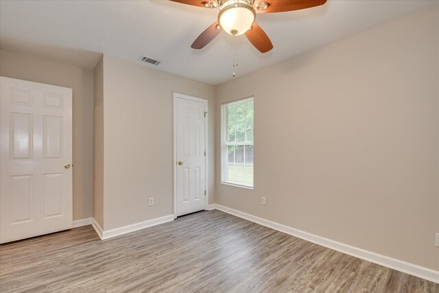 1907 Lobelia Ln, Augusta, GA 30906 - unfurnished bedroom featuring wood finished floors, baseboards, and a ceiling fan
