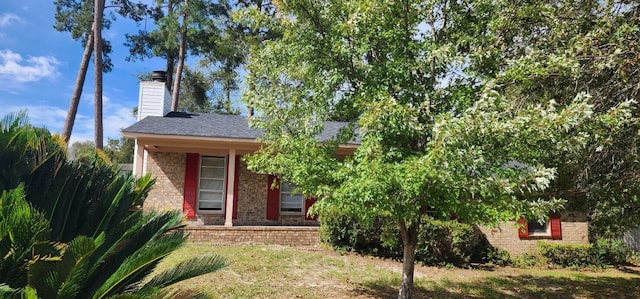 3545 Monte Carlo Dr, Augusta, GA 30906 - obstructed view of property featuring brick siding, a chimney, a front yard, and a shingled roof