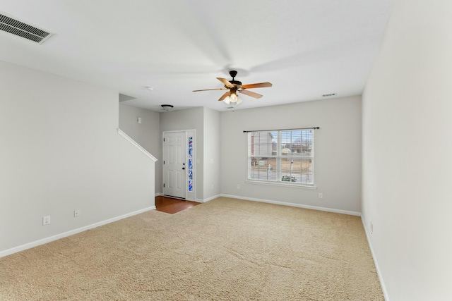 carpeted empty room with ceiling fan