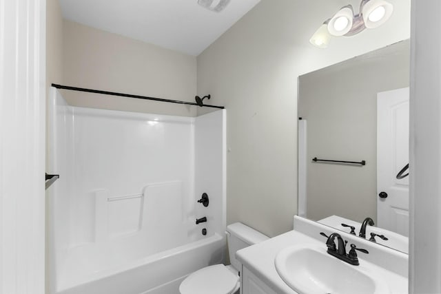 full bathroom featuring toilet, bathing tub / shower combination, and vanity