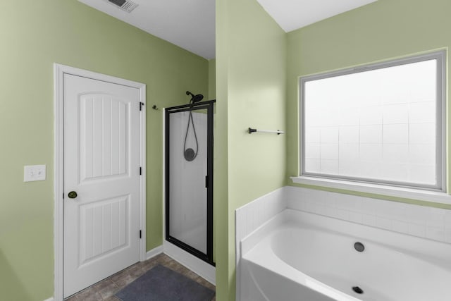 bathroom with separate shower and tub