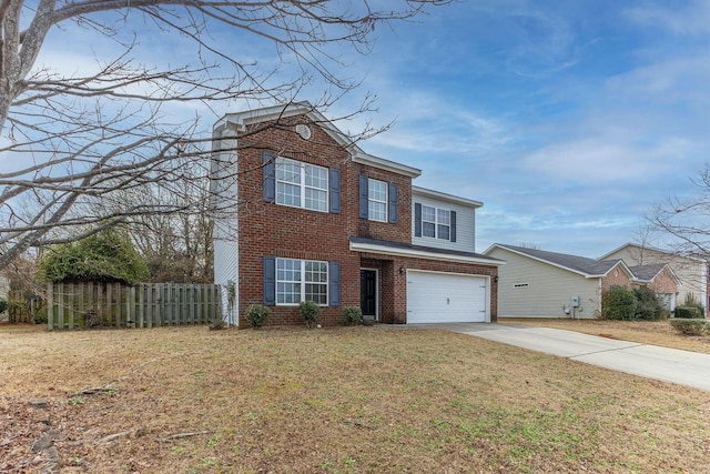 view of front of property with a front yard and a garage