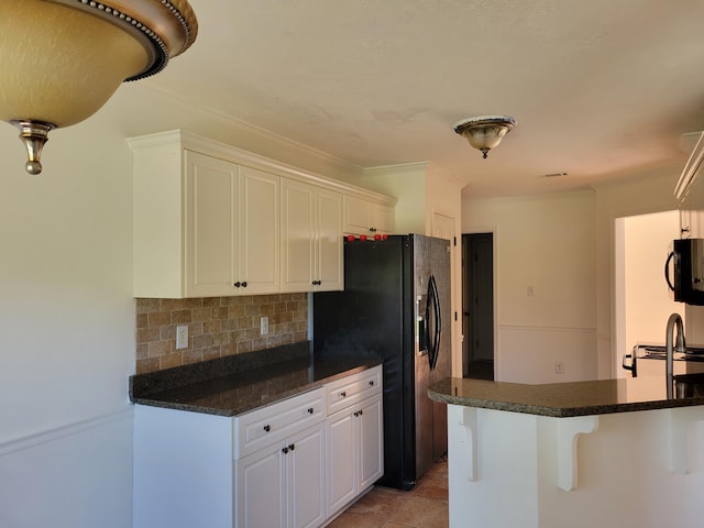 4506 Marthas Way, Grovetown, GA 30813 - kitchen featuring black appliances, backsplash, white cabinets, ornamental molding, and a kitchen breakfast bar