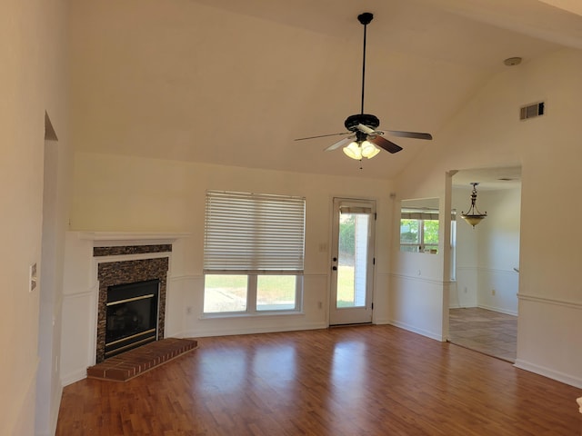 4506 Marthas Way, Grovetown, GA 30813 - unfurnished living room with wood finished floors, ceiling fan, high vaulted ceiling, and a fireplace