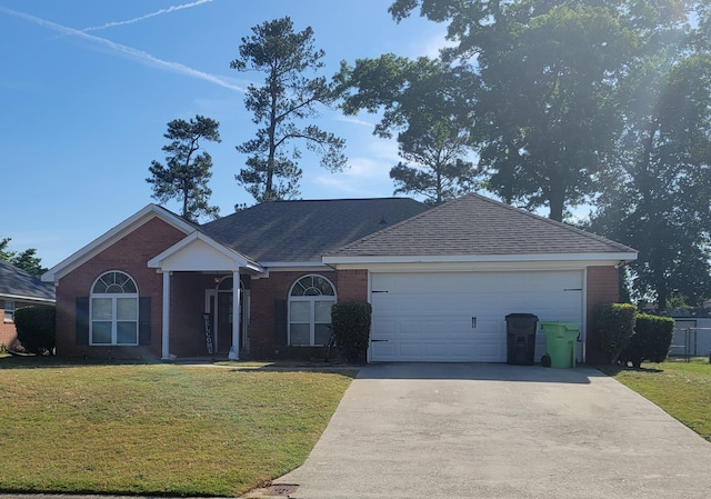 single story home featuring concrete driveway, brick siding, a garage, and a front lawn