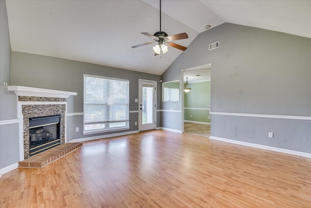4506 Marthas Way, Grovetown, GA 30813 - unfurnished living room with ceiling fan, wood finished floors, a glass covered fireplace, and high vaulted ceiling