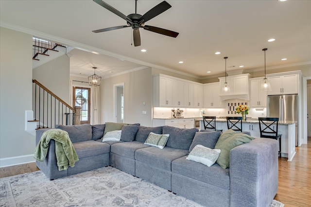 635 River Oaks Ln, Evans, GA 30809 - living area with stairway, light wood-style flooring, a ceiling fan, recessed lighting, and ornamental molding