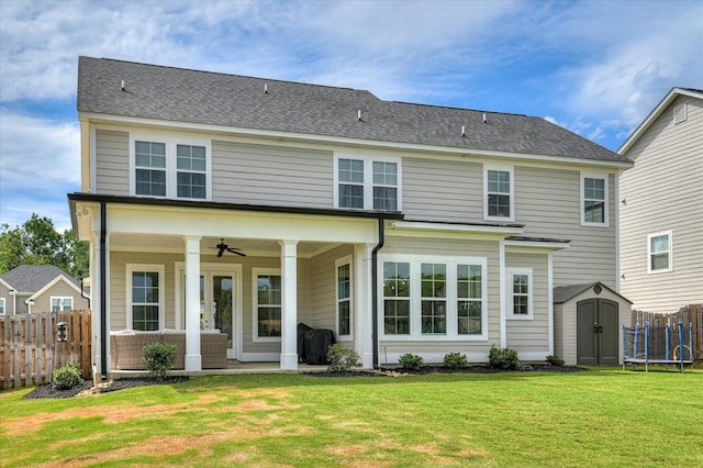 635 River Oaks Ln, Evans, GA 30809 - rear view of house featuring a storage unit, a ceiling fan, and roof with shingles