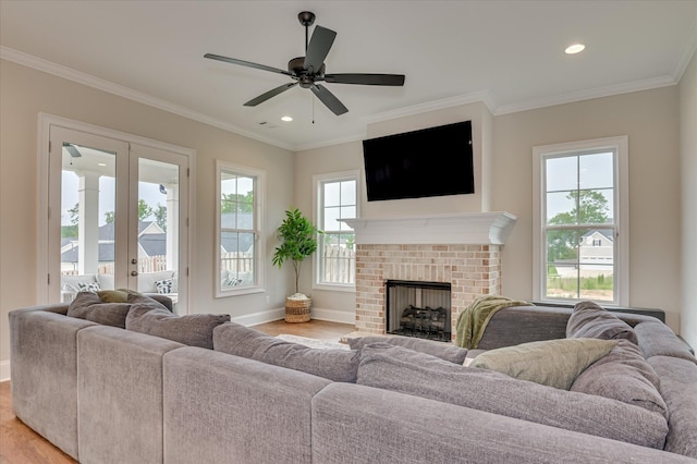 635 River Oaks Ln, Evans, GA 30809 - living room with crown molding, healthy amount of natural light, a brick fireplace, a ceiling fan, and recessed lighting
