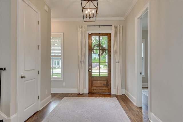 635 River Oaks Ln, Evans, GA 30809 - entrance foyer featuring wood finished floors, crown molding, and a chandelier