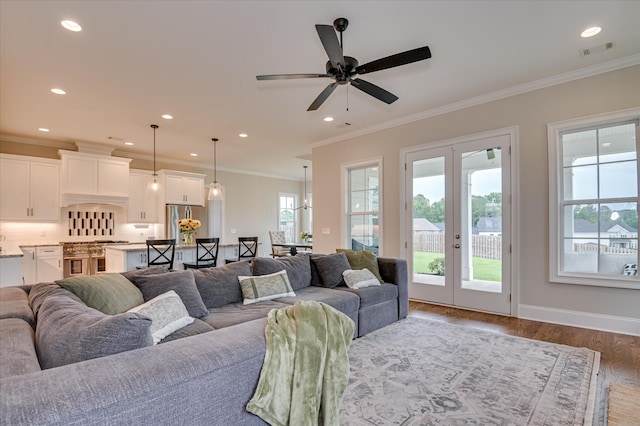 635 River Oaks Ln, Evans, GA 30809 - living room featuring french doors, wood finished floors, crown molding, a ceiling fan, and recessed lighting