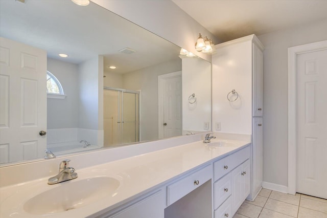 bathroom featuring separate shower and tub, vanity, and tile patterned floors