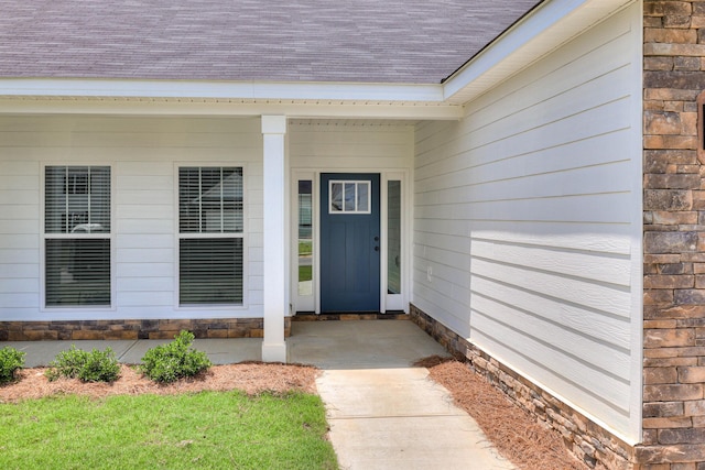 doorway to property featuring a porch