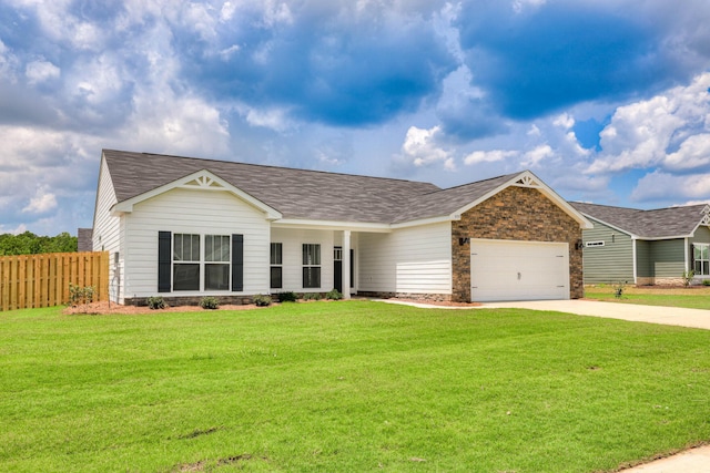 ranch-style house featuring a garage and a front yard