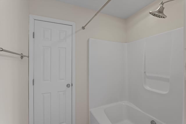bathroom with bathing tub / shower combination