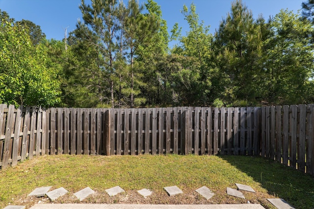 view of yard with a fenced backyard