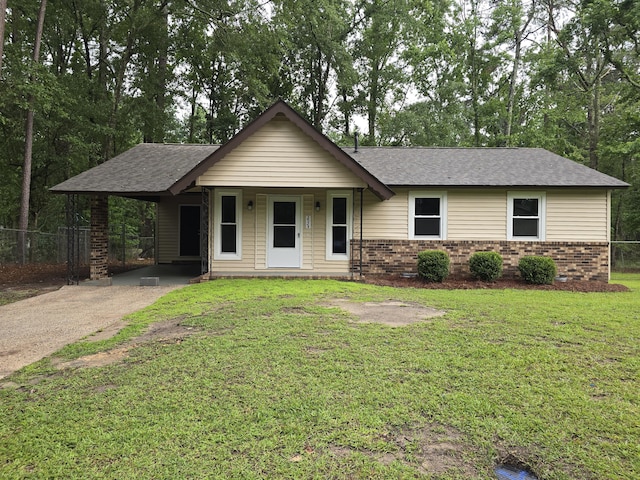 3524 Edgeworth Dr, Hephzibah, GA 30815 - view of front facade featuring brick siding, driveway, roof with shingles, and a carport
