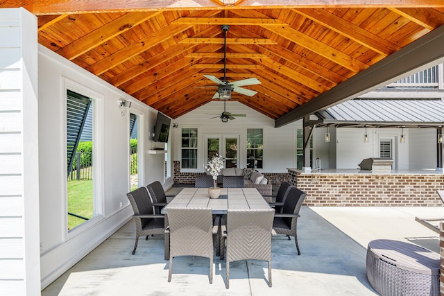 view of patio / terrace featuring ceiling fan and french doors