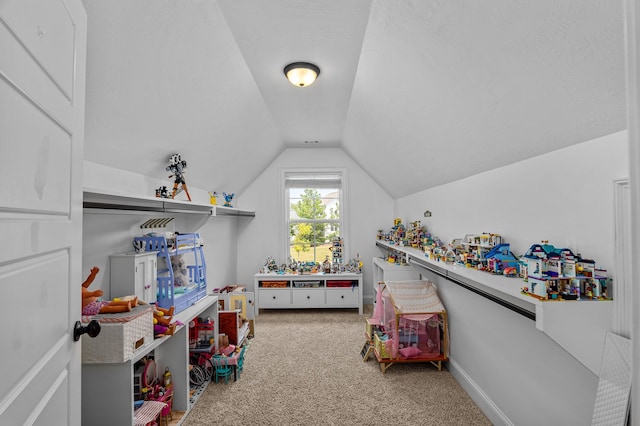 recreation room featuring carpet floors and lofted ceiling