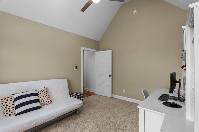 carpeted office with ceiling fan and high vaulted ceiling