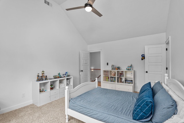 carpeted bedroom with high vaulted ceiling and ceiling fan