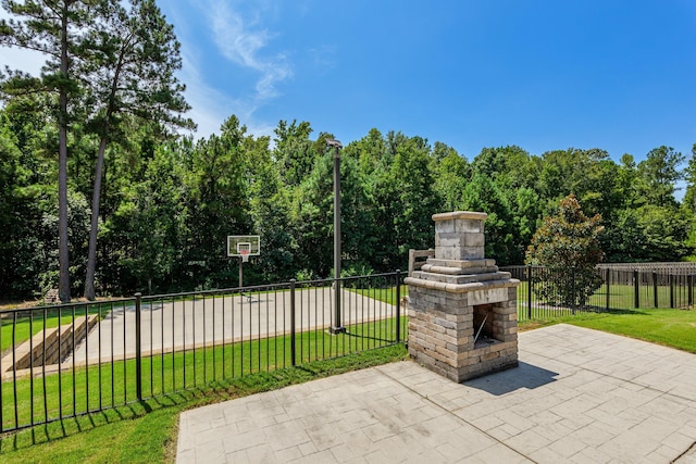 view of patio / terrace featuring an outdoor stone fireplace