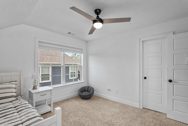 bedroom featuring ceiling fan, light carpet, and lofted ceiling