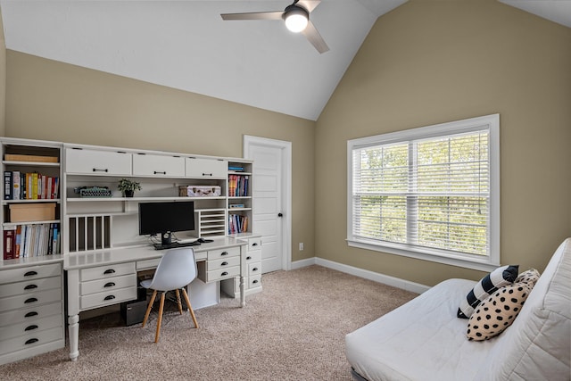 carpeted office with lofted ceiling and ceiling fan