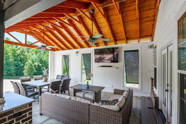 view of patio / terrace featuring a wooden deck, ceiling fan, and an outdoor living space