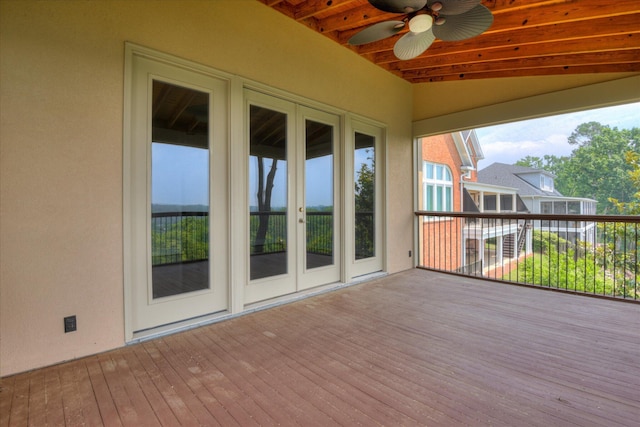 deck featuring ceiling fan and french doors