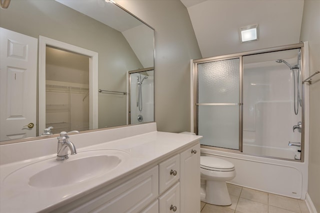 full bath featuring tile patterned floors, vanity, toilet, and bath / shower combo with glass door