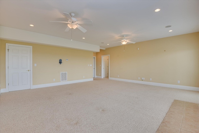 unfurnished room with ceiling fan, baseboards, recessed lighting, and light carpet