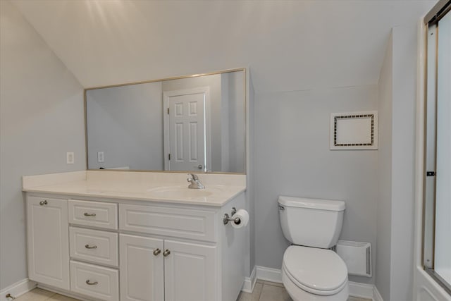 bathroom with baseboards, toilet, and vanity