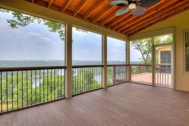 unfurnished sunroom with a ceiling fan and healthy amount of natural light