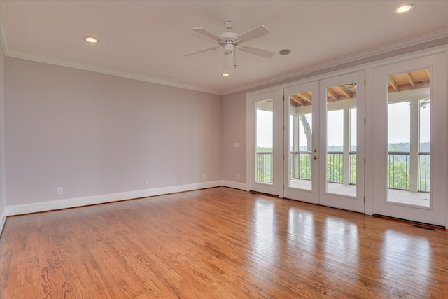 unfurnished room with ornamental molding, baseboards, a ceiling fan, wood finished floors, and recessed lighting