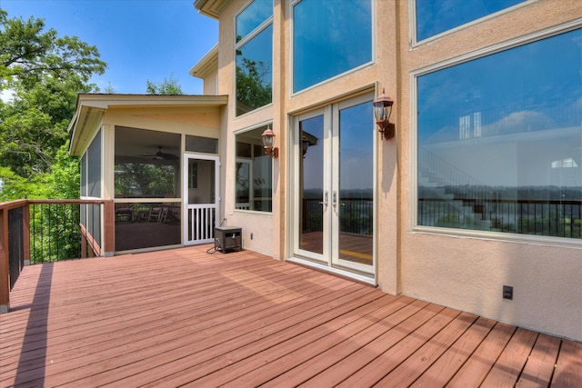 wooden deck with a sunroom