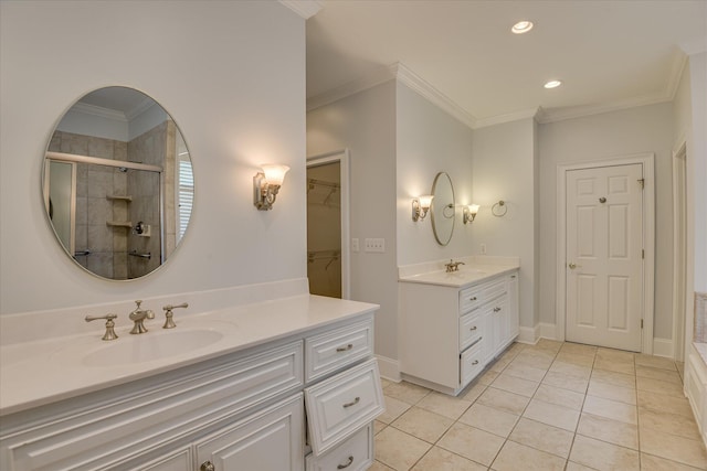 full bath with a stall shower, ornamental molding, two vanities, tile patterned floors, and recessed lighting