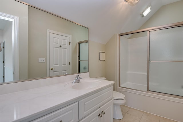 full bathroom featuring vaulted ceiling, toilet, tile patterned floors, vanity, and bath / shower combo with glass door